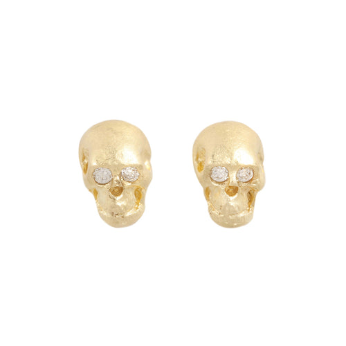 14k Gold skull-shaped earrings with embedded stones on a white background